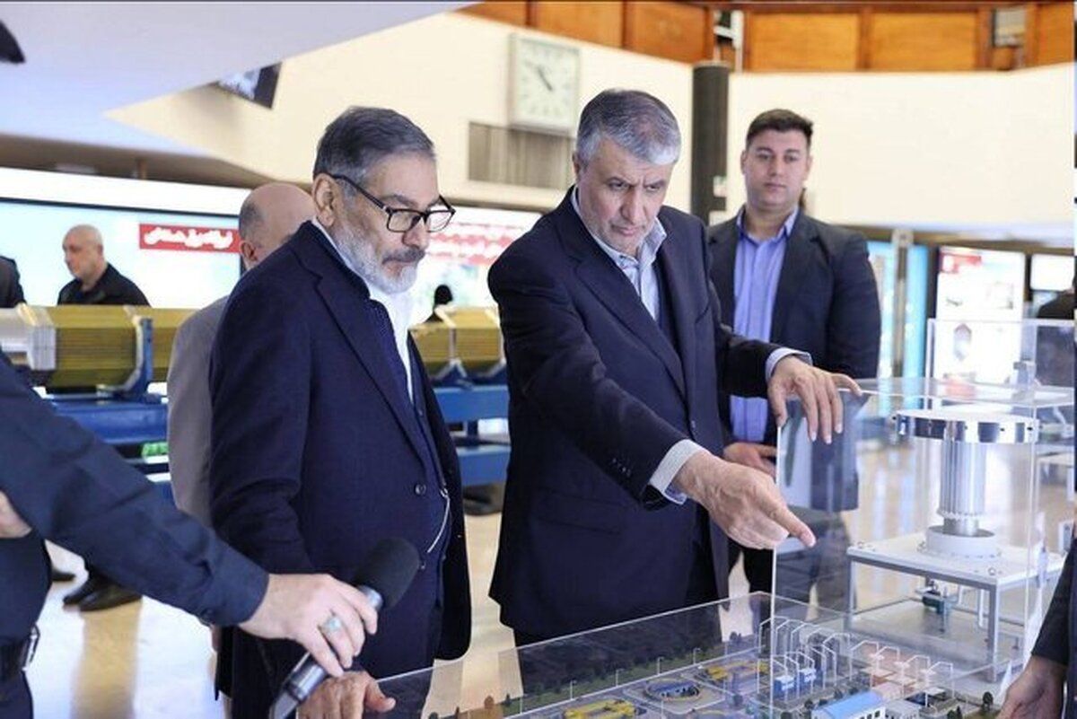 Ali Shamkhani, the former secretary of the Supreme National Security Council, and Mohammad Eslami, the director of the Atomic Energy Organization of Iran, during an expo on the country’s nuclear program in Tehran (February 2025) 