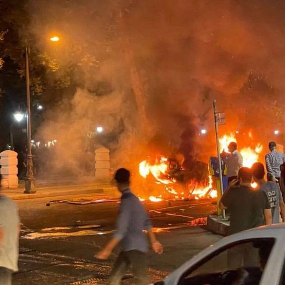 A police vehicle in flames in Sabzevar on Tuesday