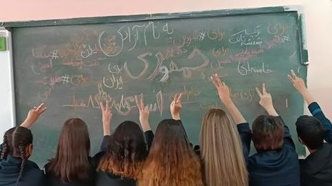 Iranian schoolgirls removing their headscarves in solidarity with 2022 Women, Life, Freedom protests