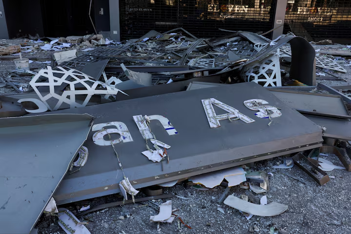 Debris lies at the site of a damaged branch of Al-Qard al-Hassan', a financial institution linked to Lebanon's Hezbollah in Beirut suburbs, Lebanon, October 21, 2024.