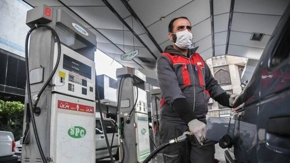An attendant pumping gas in Tehran