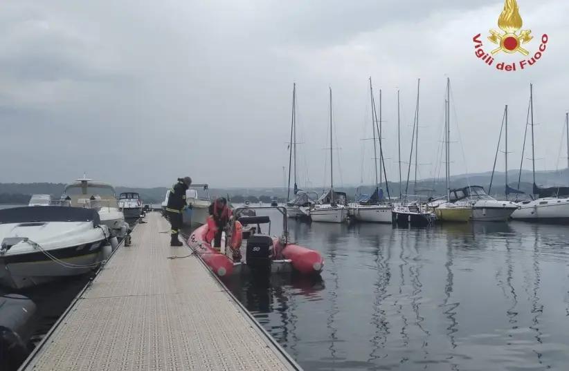 Firefighters search for survivors after a boat capsized in Lake Maggiore, in northern Italy, May 29, 2023  
