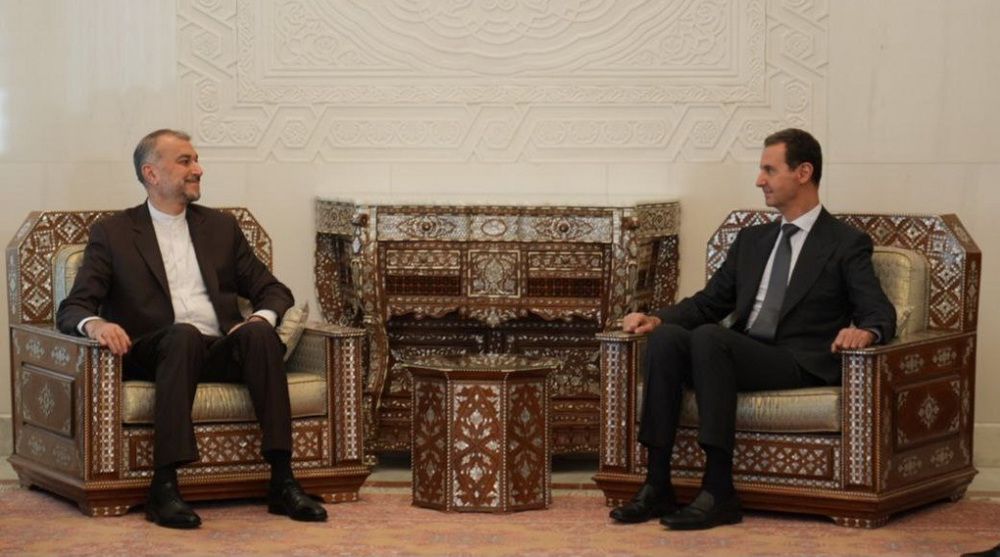 Syrian President Bashar al-Assad (right) meets with Iranian Foreign Minister Hossein Amir-Abdollahian in Damascus on August 31, 2023. 