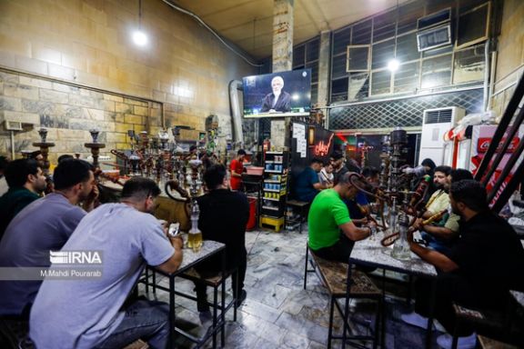 People watching a presidential debate from a teahouse in Karaj (June 2024)