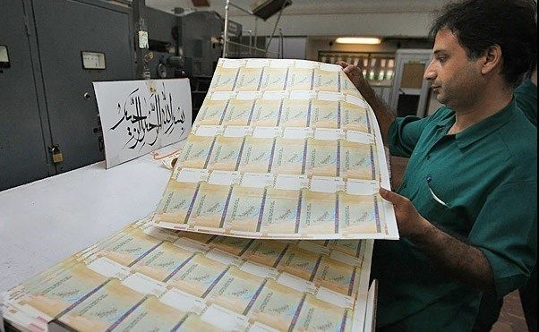 An employee of Iran’s Central Bank during the checking the quality of newly printed banknotes  