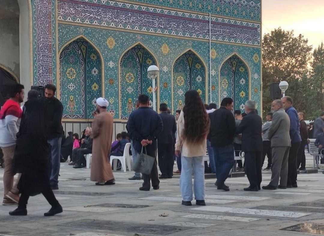An Iranian woman unveiling in public  