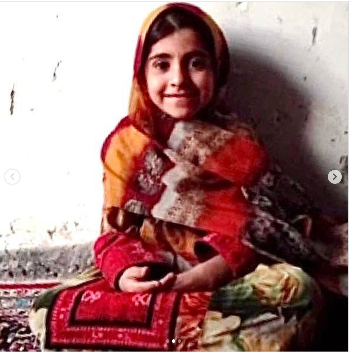 Seven-year-old Hasti Narouei in traditional Baluchi dress