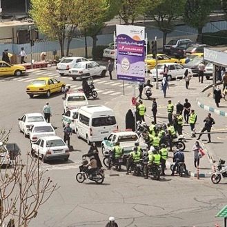 Hijab police vans and agents on motorbikes at a Tehran square