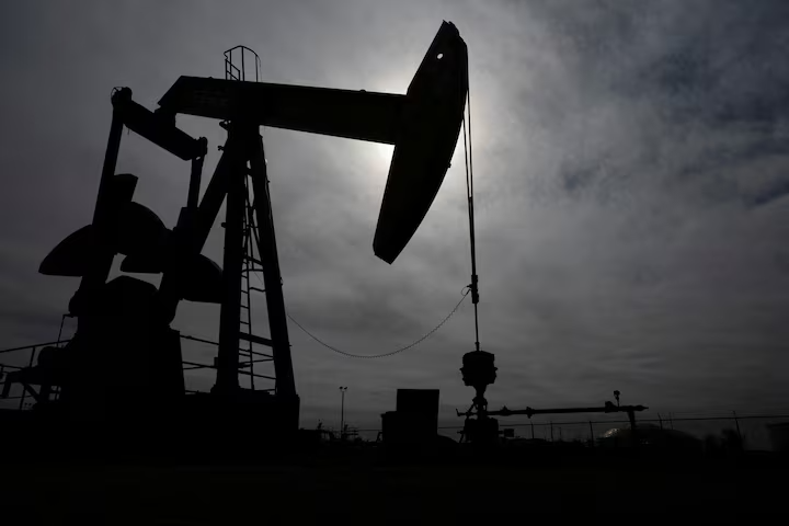 A pump jack operates near a crude oil reserve in the Permian Basin oil field near Midland, Texas, US February 18, 2025. 