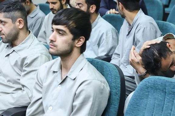Mohammad Hosseini (left) and Mohammad Mehdi Karami (center) during a court hearing in Tehran