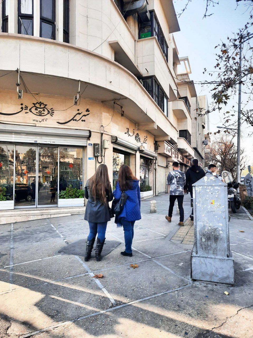 Two Iranian women without hijab in Tehran’s Enghelab street  (file photo)