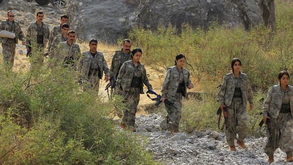 Fighters with the Kurdistan Workers' Party (PKK) walk for a disarmament ceremony marking a significant step toward ending the decades-long conflict between Turkey and the outlawed group, in the Qandil mountains, Iraq October 26, 2025.