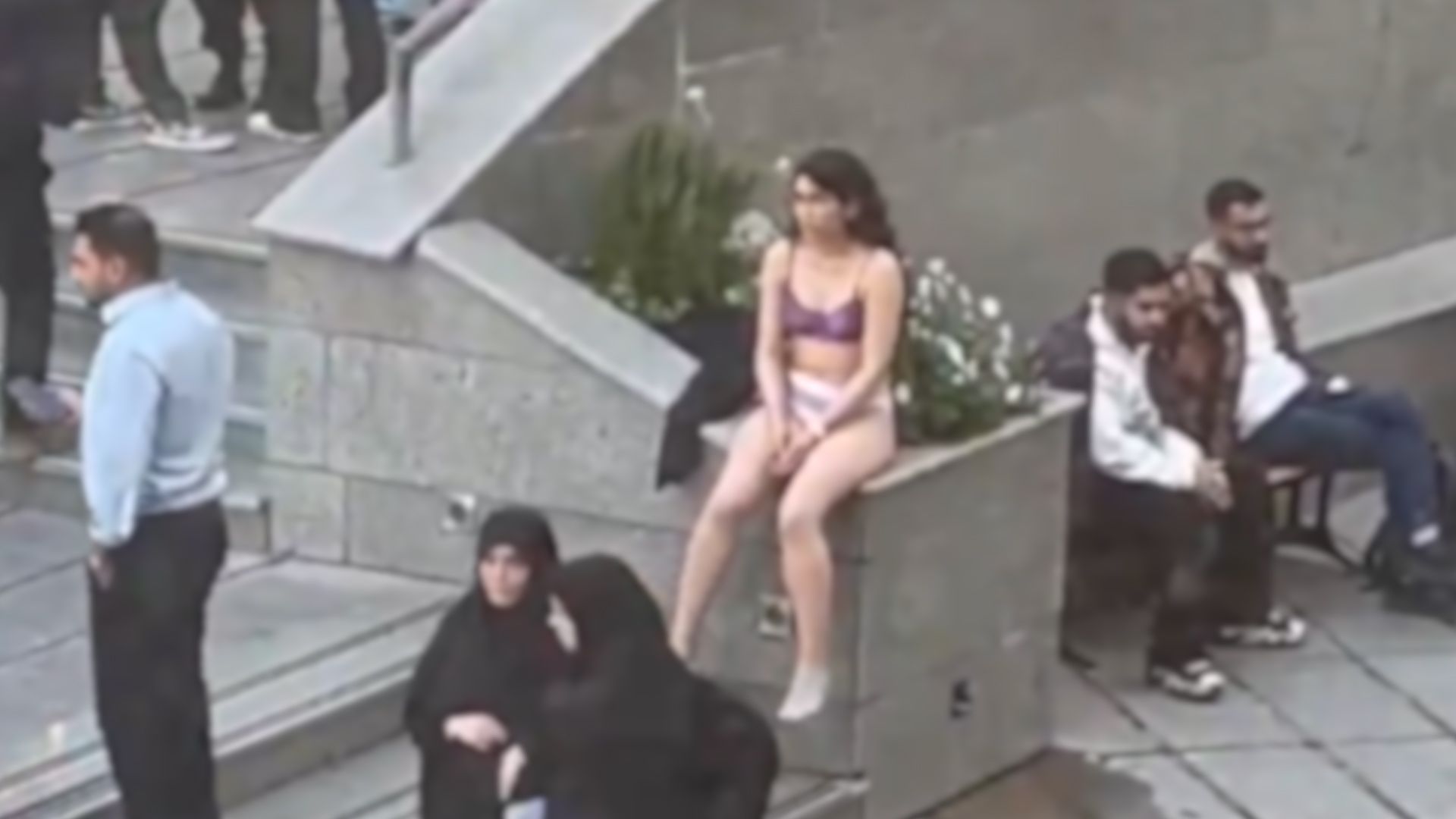 Iranian student strips in protest against assault by hijab enforcers