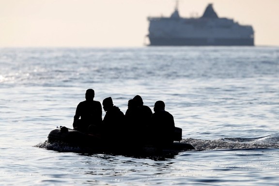 Migrants cross the English Channel in an inflatable boat near Dover, Britain, File Photo.