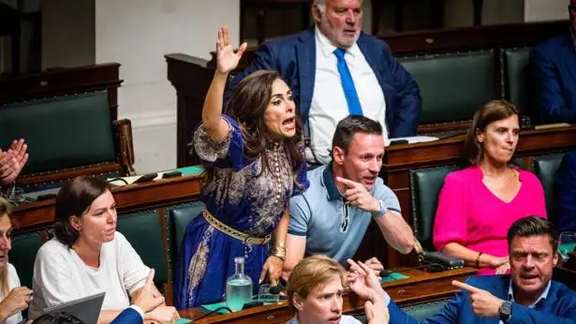 Darya Safai (center) reacts during a plenary session of the Chamber at the Federal Parliament in Brussels in June 2023.