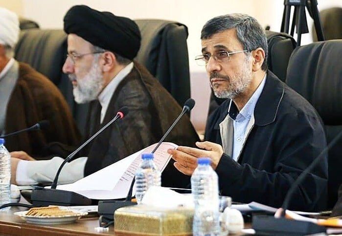 Former Iranian president Mahmoud Ahmadinejad (right) and President Ebrahim Raisi during a session  (undated)