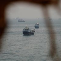 Iran officials threaten Hormuz escalation as Trump says deal is near