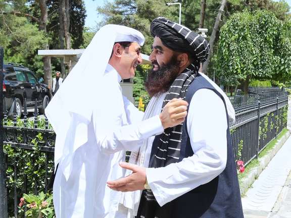 The National Security Advisor to the Emir of Qatar Mohammed bin Ahmed al-Misnad (left) and Afghanistan’s Acting Foreign Minister Amir Khan Muttaqi