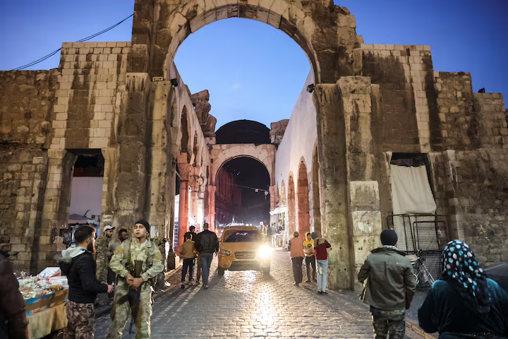 People walk, after rebels seized the capital and ousted Syria's Bashar al-Assad, in Damascus, Syria December 9, 2024.
