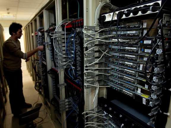 A computer engineer checks equipment at an internet service provider in Tehran February 15, 2011.