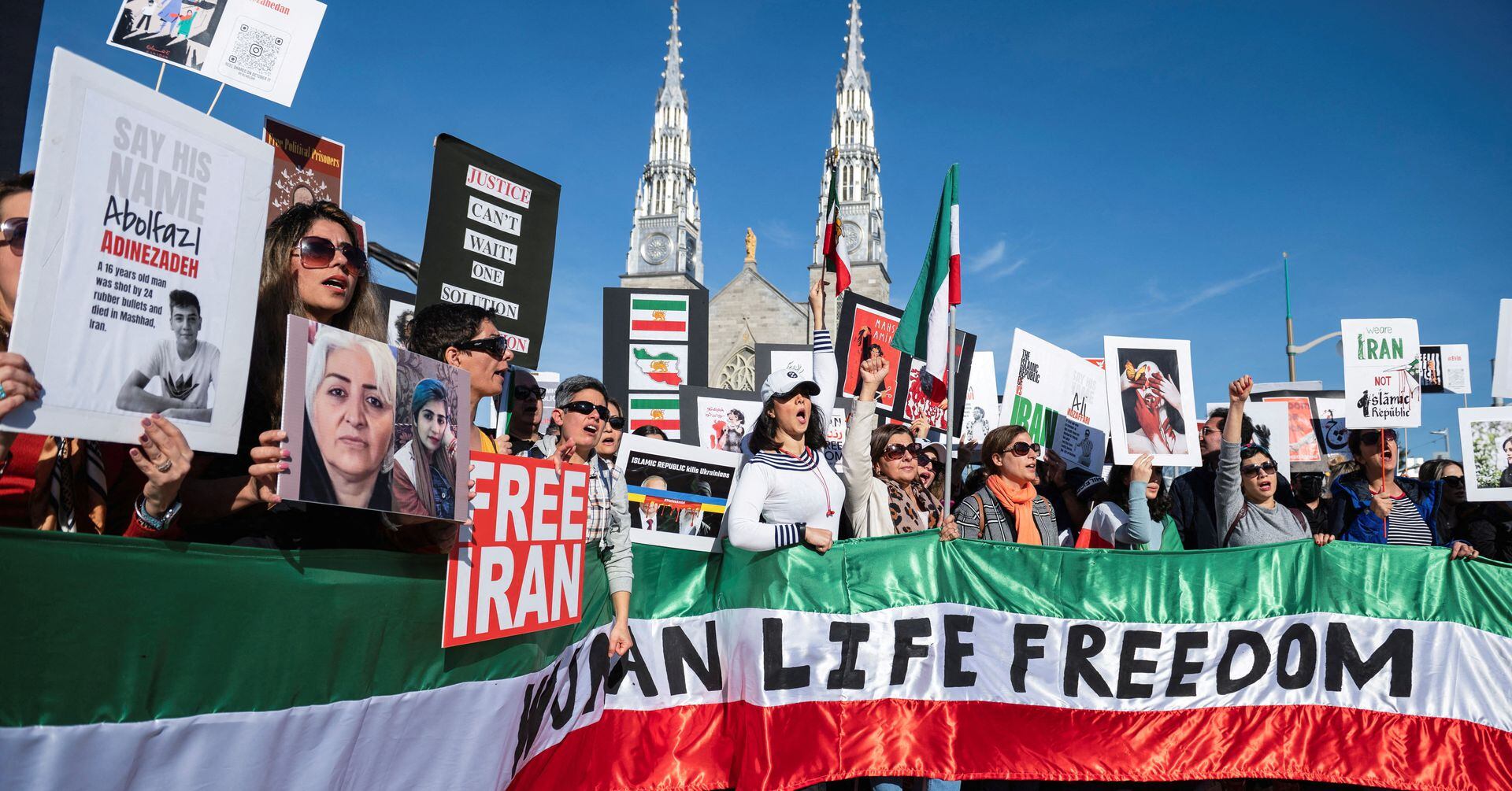 Protestors in support of women in Iran hold a banner reading 'Women Life Freedom' during a protest following the death of Mahsa Amini, in Ottawa, Ontario, Canada, October 29, 2022.