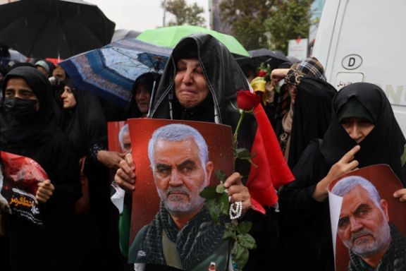 A woman holding an image of late Iranian military commander General Qassem Soleimani, in Tehran, Iran September 28, 2024.