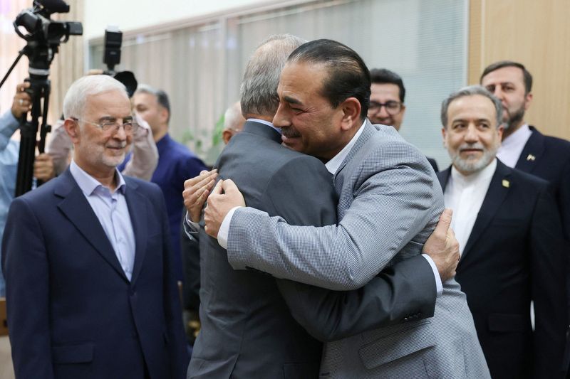 Pakistani Field Marshal Asim Munir hugs Iran's President Masoud Pezeshkian in a meeting in Tehran on May 23, 2026