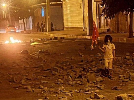 A small girl during the protests in Sanandaj, Kordestan province