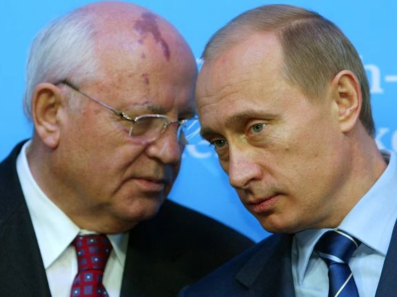 Russian President Vladimir Putin (R) listens to former President of the Soviet Union Mikhail Gorbachev during a news conference following bilateral talks with German Chancellor Gerhard Schroeder at Schloss Gottorf Palace in the northern German town of Schleswig, Germany December 21, 2004