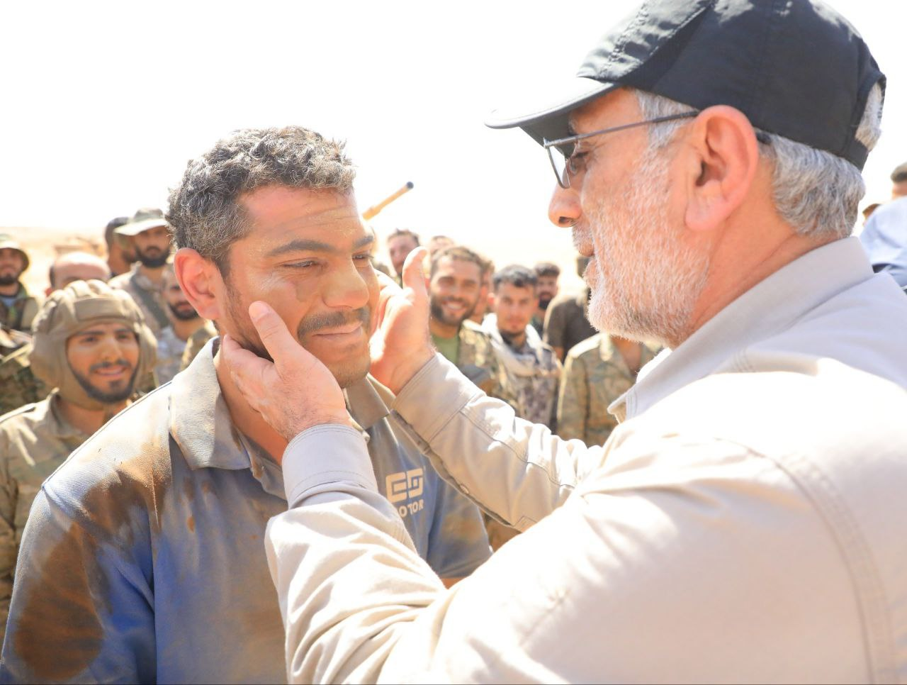 A photo released by Iranian media of IRGC’s Quds Force Commander Esmail Qaani and Syrian fighters in an undisclosed location in Syria  