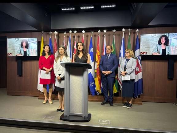 Speaking with reporters in Ottawa are ICJ members Nazanin Afshin-Jam MacKay (co-founder) and Tara Dachek, as well as Senator Julie Miville-Dechêne, Liberal MP Ali Ehsassi and NDP MP Heather McPherson.