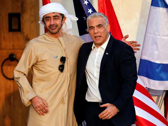 Israel's Foreign Minister Yair Lapid greets his UAE counterpart Sheikh Abdullah bin Zayed Al Nahyan on Sunday.
