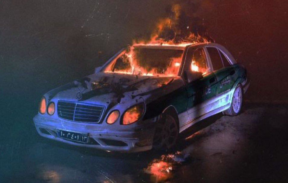 An artwork created in support of protests in the last week of the Iranian year (Charshanbeh Souri) showing a police car on fire  (March 2023)