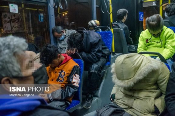 Homeless people sleeping on Tehran city buses in late December 2021.