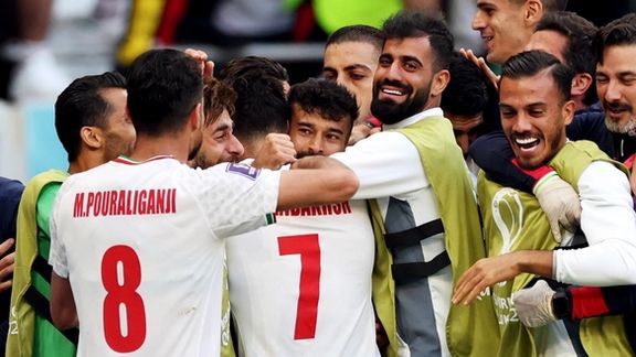 The Iranian team celebrates after its win against Wales on November 25, 2022