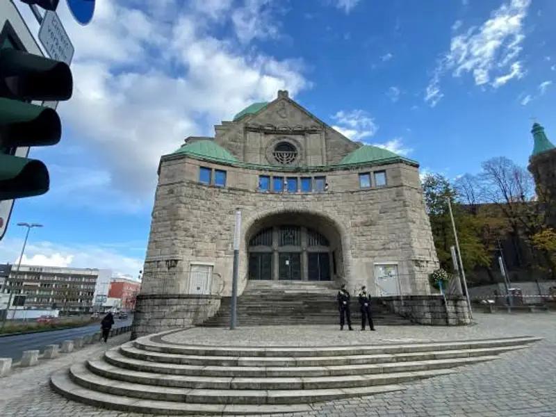 Police officers guard the Essen synagogue after several bullet holes where found this morning in a nearby building in Essen, Germany, November 18, 2022.