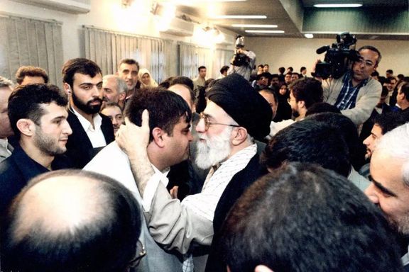 Iran’s ruler Ali Khamenei kissing weightlifting champion Hossein Rezazadeh