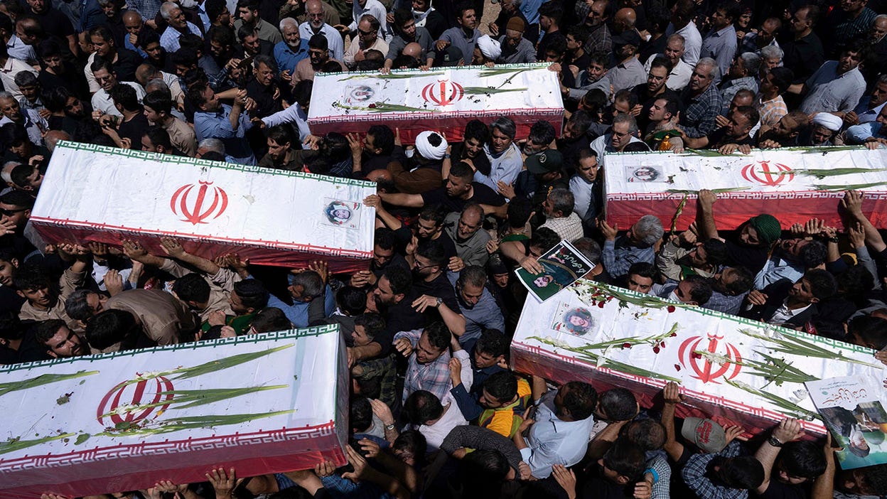 Israel attacks Iran state media, orders evacuations and moots regime change