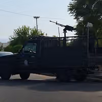 Iran deploys security forces as gasoline price rise takes effect