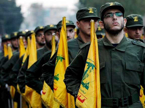 Hezbollah fighters marching in Lebanon. FILE PHOTO