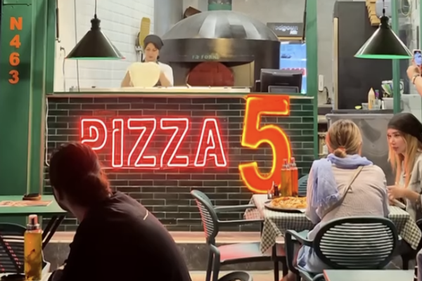 Dollar-pegged pizza in Tehran points to a different kind of regime change