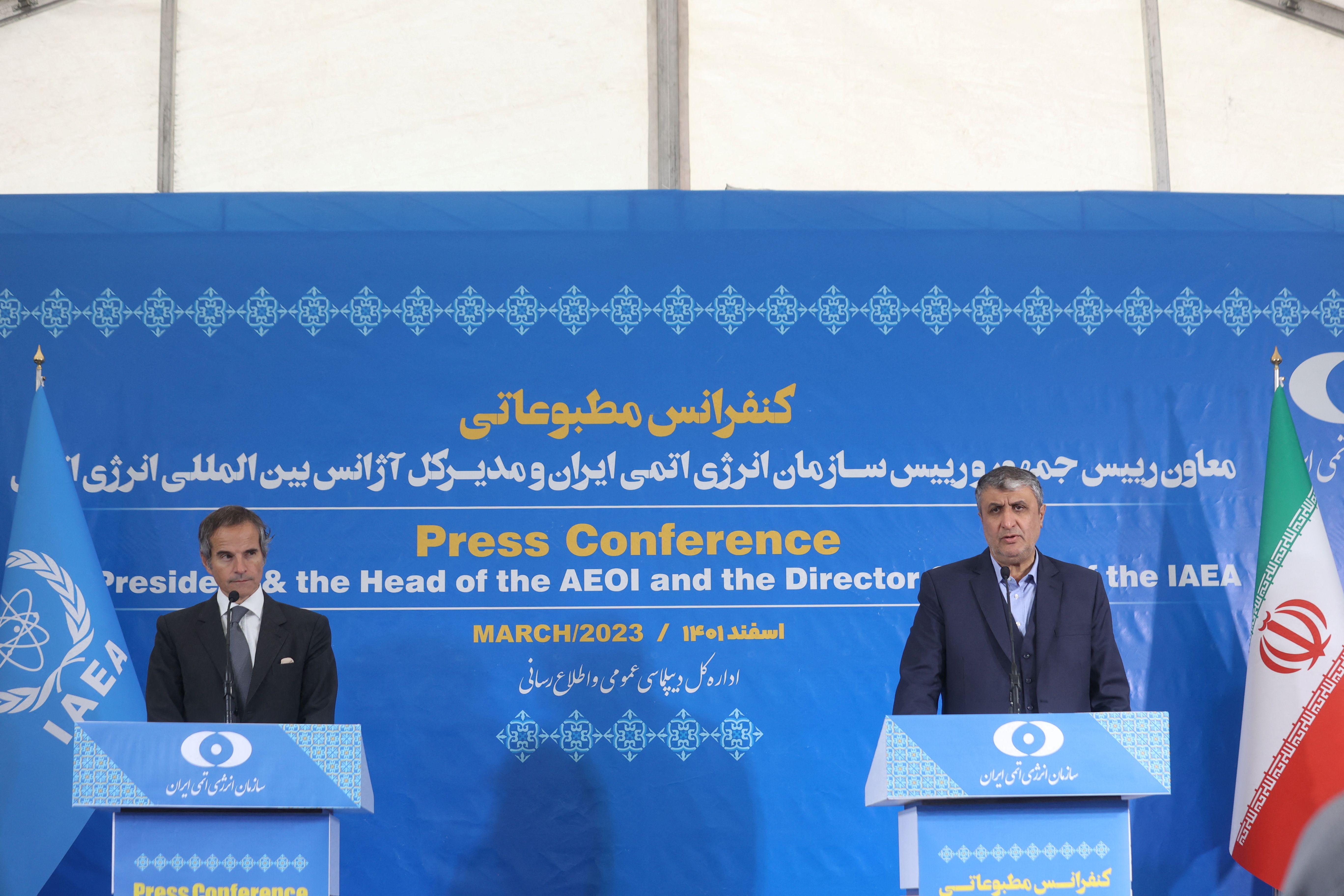 Head of Iran's Atomic Energy Organization Mohammad Eslami and International Atomic Energy Agency (IAEA) Director General Rafael Grossi attend a news conference, in Tehran, Iran, March 4, 2023. 