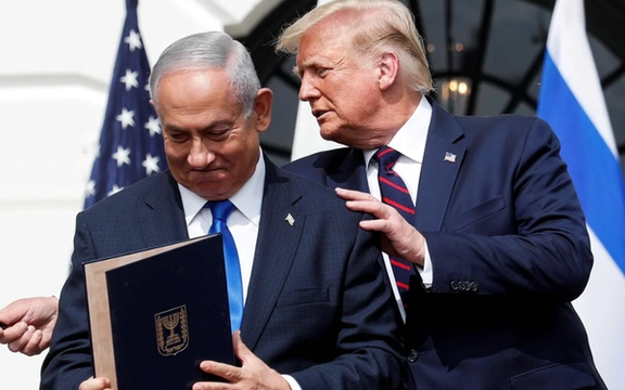 Israel's Prime Minister Benjamin Netanyahu stands with US President Donald Trump after signing the Abraham Accord in Washington, US, September 15, 2020.