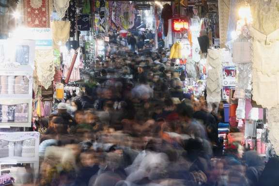 A long exposure image shows Iranians walking through Tehran Bazaar on February 1, 2023.
