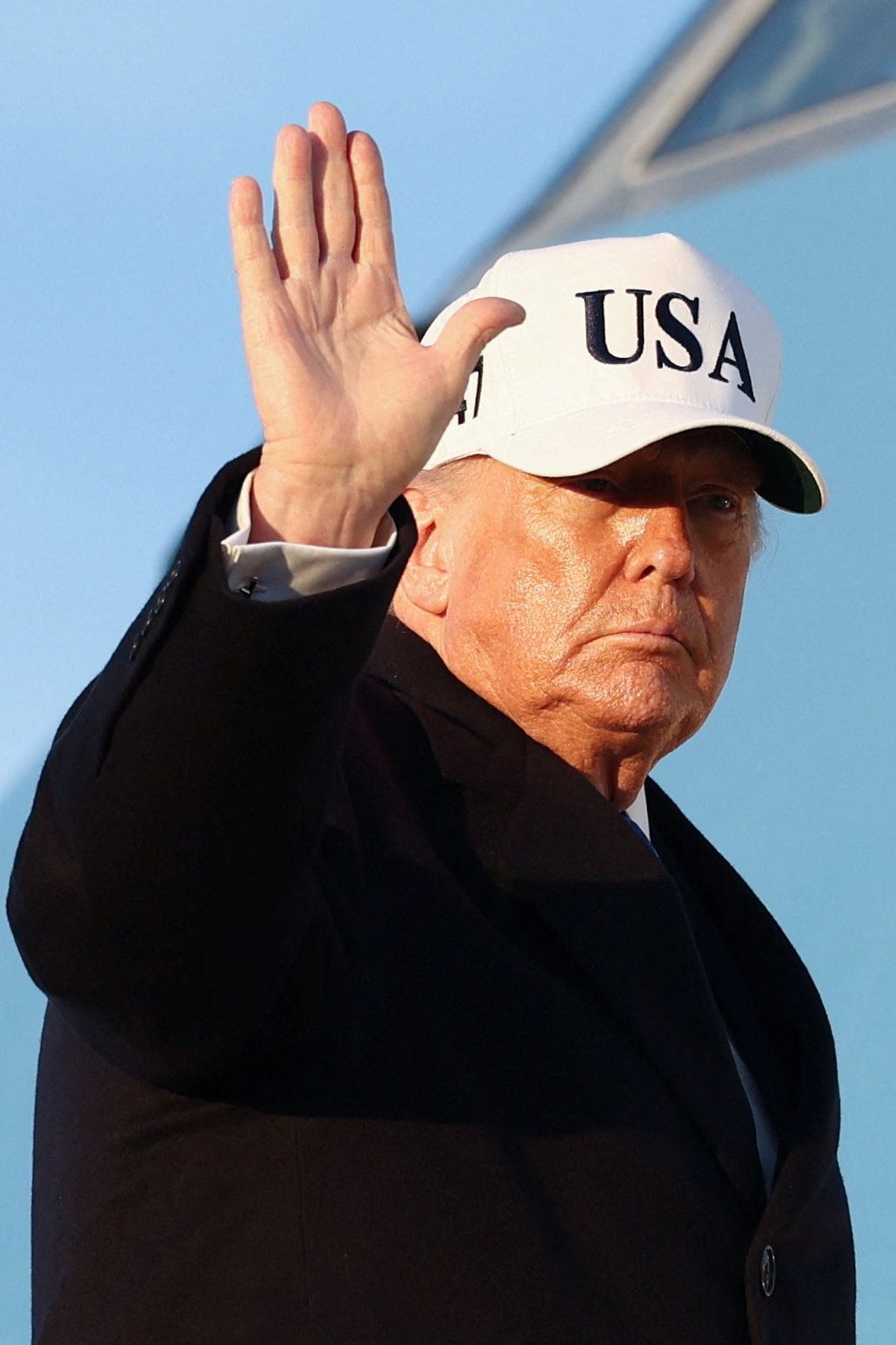 US President Donald Trump waves as he boards Air Force One for travel to Florida, at Joint Base Andrews, Maryland, US, March 13, 2026