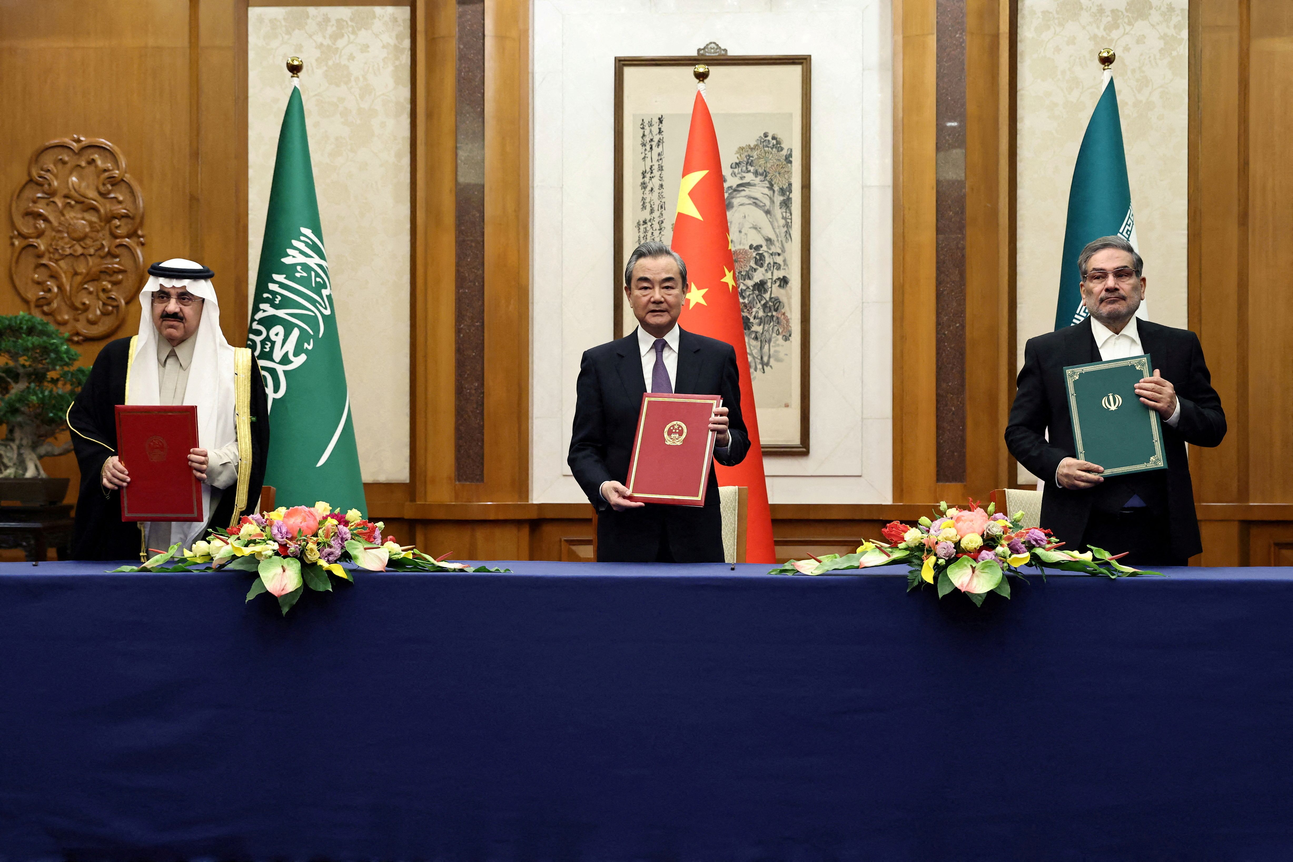Wang Yi, a member of the Political Bureau of the Communist Party of China (CPC) Central Committee and director of the Office of the Central Foreign Affairs Commission attends a meeting with Secretary of Iran's Supreme National Security Council Ali Shamkhani and Minister of State and national security adviser of Saudi Arabia Musaad bin Mohammed Al Aiban in Beijing, China March 10, 2023. 
