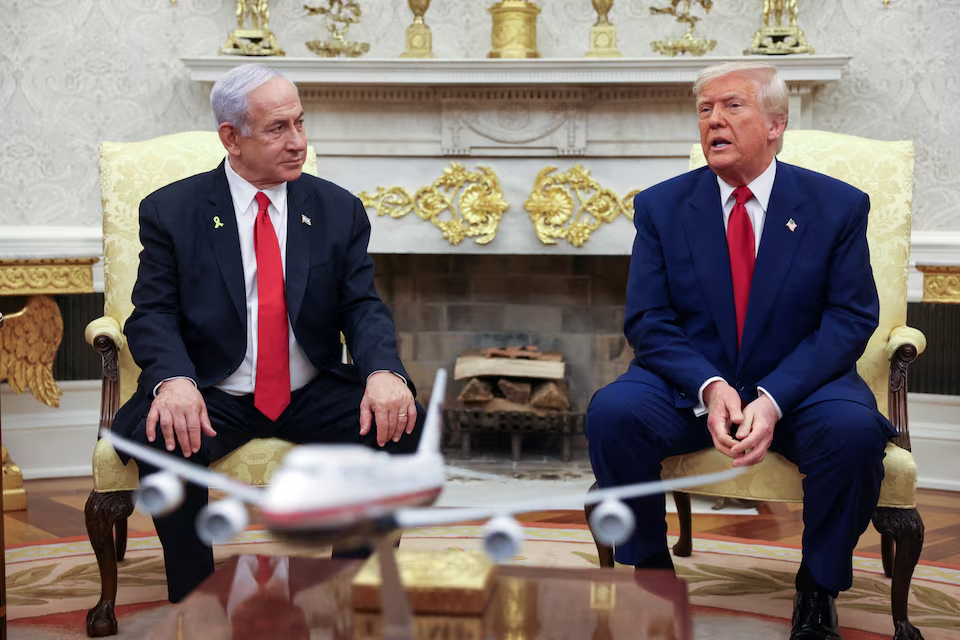 US President Donald Trump talks to Israeli Prime Minister Benjamin Netanyahu during a meeting where Trump announced nuclear talks with Iran, Washington, US, April 7, 2025.