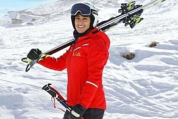 Iranian skier who had fled to Germany makes homecoming, praises Khamenei