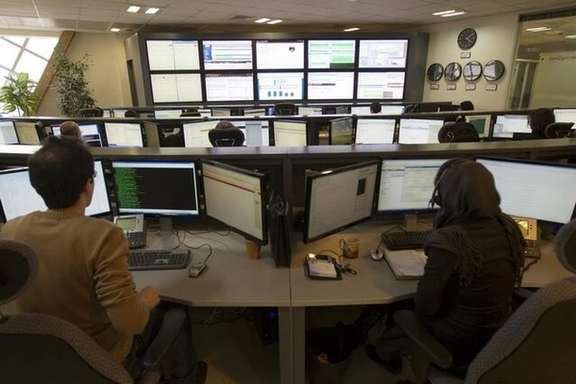Technicians monitor data flow in the control room of an internet service provider in Tehran February 15, 2011