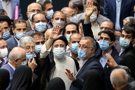 President Ebrahim Raisi surrounded by his supporters in parliament during his inauguration in August 2021.